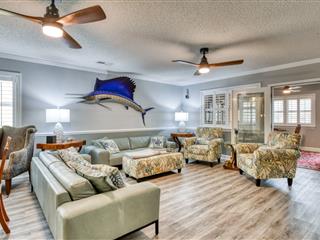 Spacious Living Room. Upper-Level Living Area - Two Sofas - Two Comfortable Armchairs - Two Ceiling Fans - LVT Flooring.